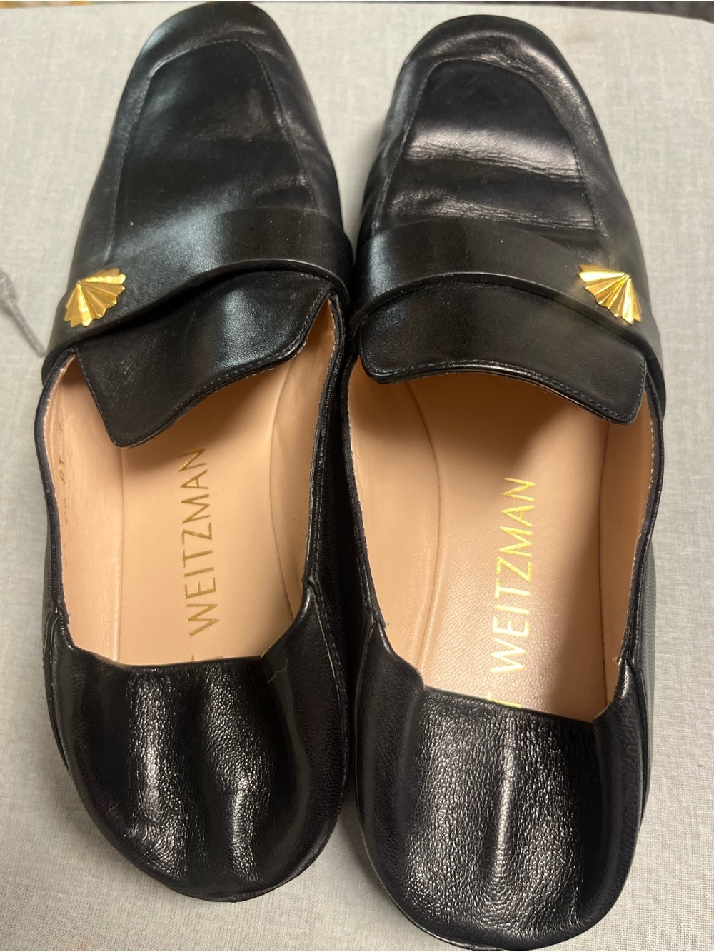 Stuart Weitzman Black Leather Loafers with Gold Shell Accent